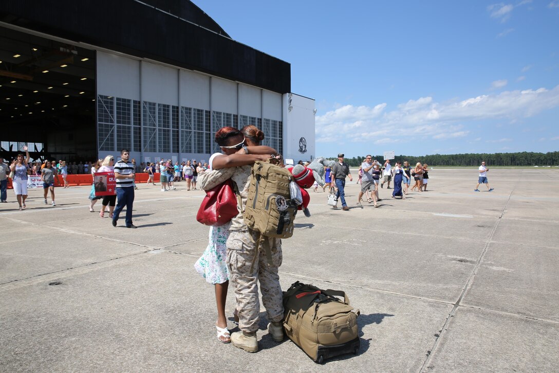 Hilda Turman embraces her daughter, Petty Officer Third Class Jocelyn Schrecker, a hospital corpsman with Marine Aerial Refueler Transport Squadron 252, outside the squadron’s hangar Monday. Schrecker had been on a seven month deployment to southwester Afghanistan. 