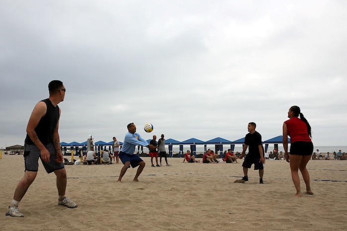 Col. Michael E. Cordero bumps the volleyball during the Commanding Generals Cup, Four Person Beach Volleyball Tournament held at Del Mar Beach Resort here August 7.  Cordero is the commanding officer of Headquarters and Support Battalion here. The tournament is an annual event and had over 120 Marines and sailors in attendance. 