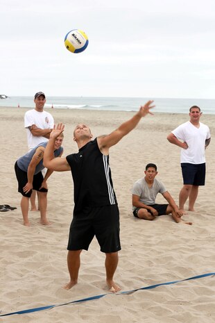 Sgt. Brian Riddle serves the ball during of the Commanding Generals Cup, Four Person Beach Volleyball Tournament held at Del Mar Beach Resort here August 7. Riddle is a Marine with Wounded Warriors Battalion-West here. The tournament is an annual event and had over 120 Marines and sailors in attendance.