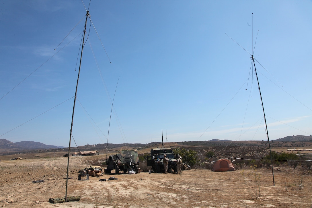 Marines with Combat Logistics Battalion 5, Combat Logistics Regiment 1, 1st Marine Logistics Group, operate high frequency antennas during a communications exercise aboard Camp Pendleton, Calif., July 25, 2013. They attempted to send messages to receivers as far as Camp Lejeune, N.C, a distance of approximately 3,000 miles, using an 80-foot-long antenna powered by 150 watts.