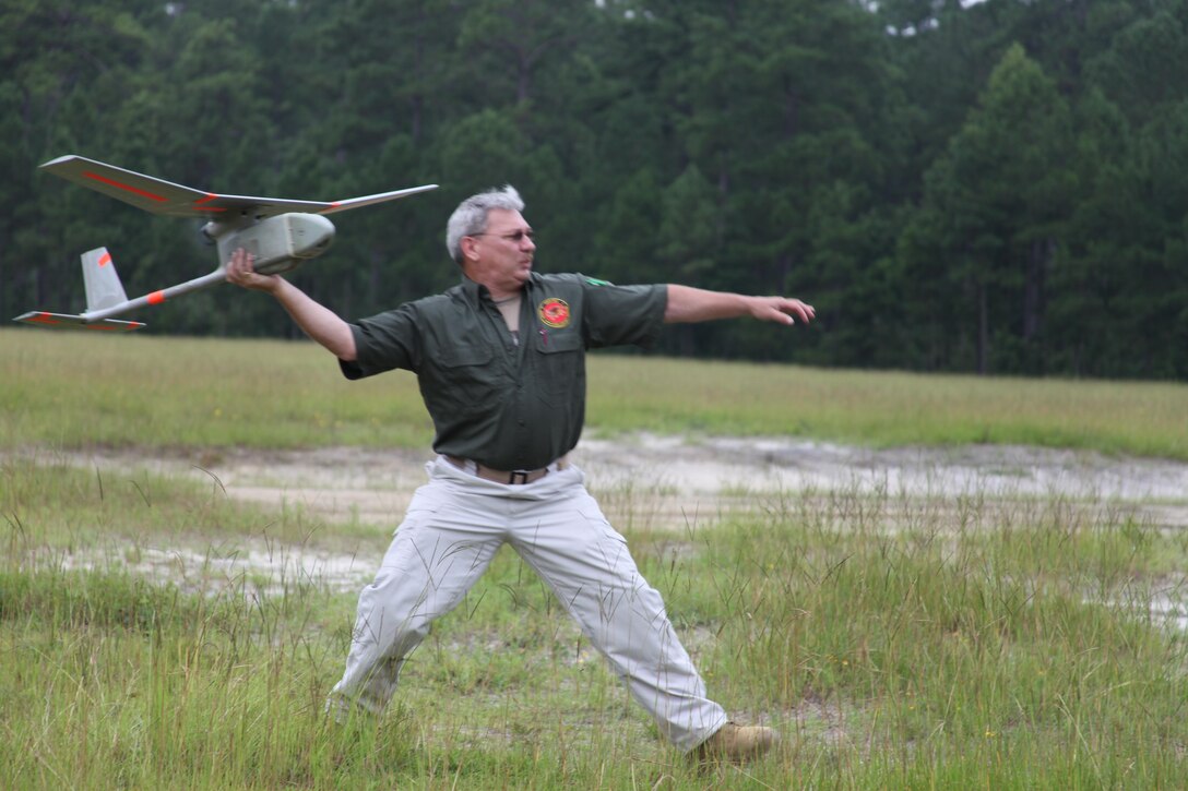 Andrew F. Archetti, a SUAS training Instructor with PMA -263 Training and Logistics Support Activity, is attempting to throw the RQ-11B DDL, August 2, at Landing Zone Woodpecker.  After learning the basics, instructors obtain the certification in the immediate course to be proficient in their occupation. The more knowledgeable the instructors are the better it is for them to teach our service members how to operate and successfully use the Unmanned Air Vehicle. 