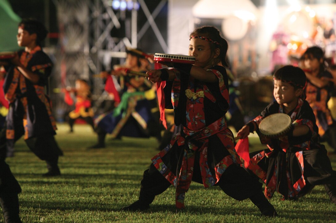 Okinawa musicians give a taiko performance July 27 at the 36th annual Urasoe Tedako Matsuri Festival. The tedako festival pays homage to a powerful king of the ancient Ryukyu kingdom. 