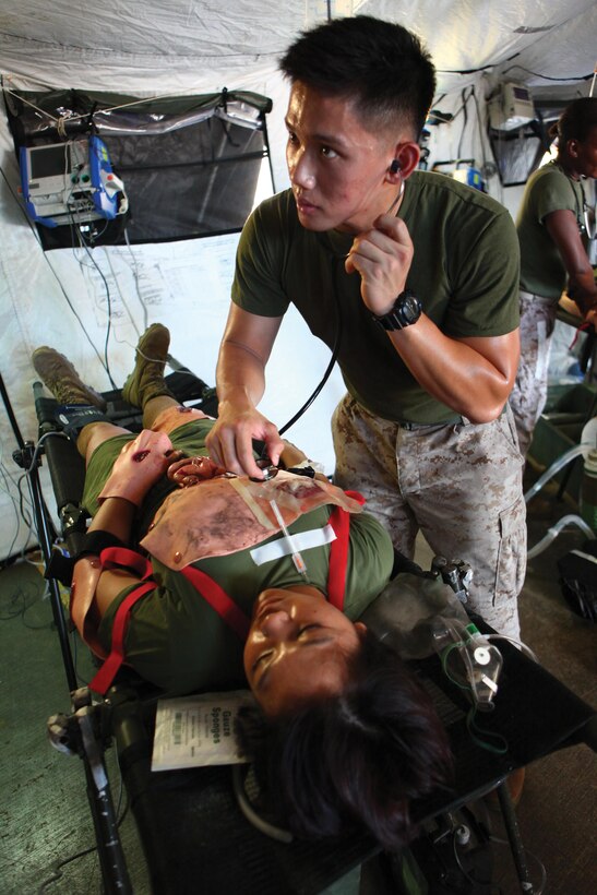 Petty Officer 2nd Class Nico DaSilva, right, checks the heartbeat of a mock casualty Aug. 1 during a forward resuscitative care course at the Simulated Trauma Advanced Training Center, Camp Foster. The course familiarized corpsman in the areas of collecting, clearing, treating, holding and evacuating casualties in the Navy’s forward-deployed echelon, while in support of Marine Air-Ground Task Force operations, according to Petty Officer 2nd Class Jerricson B. Peralta, an instructor with the center and a hospital corpsman with the battalion. DaSilva is also a corpsman with the battalion. 