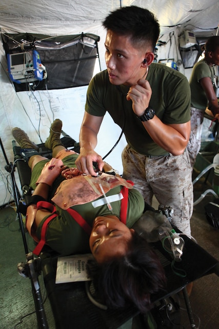 Petty Officer 2nd Class Nico DaSilva, right, checks the heartbeat of a mock casualty Aug. 1 during a forward resuscitative care course at the Simulated Trauma Advanced Training Center, Camp Foster. The course familiarized corpsman in the areas of collecting, clearing, treating, holding and evacuating casualties in the Navy’s forward-deployed echelon, while in support of Marine Air-Ground Task Force operations, according to Petty Officer 2nd Class Jerricson B. Peralta, an instructor with the center and a hospital corpsman with the battalion. DaSilva is also a corpsman with the battalion. 
