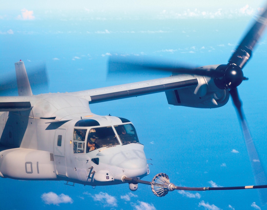 An MV-22B Osprey receives an aerial refuel Aug. 2 during a flight from Marine Corps Air Station Futenma to Townsville, Australia. The flight is currently the longest to be performed by the Osprey in the Pacific region. The Osprey is assigned to Marine Medium Tiltrotor Squadron 265, Marine Aircraft Group 36, 1st Marine Aircraft Wing, III Marine Expeditionary Force. 