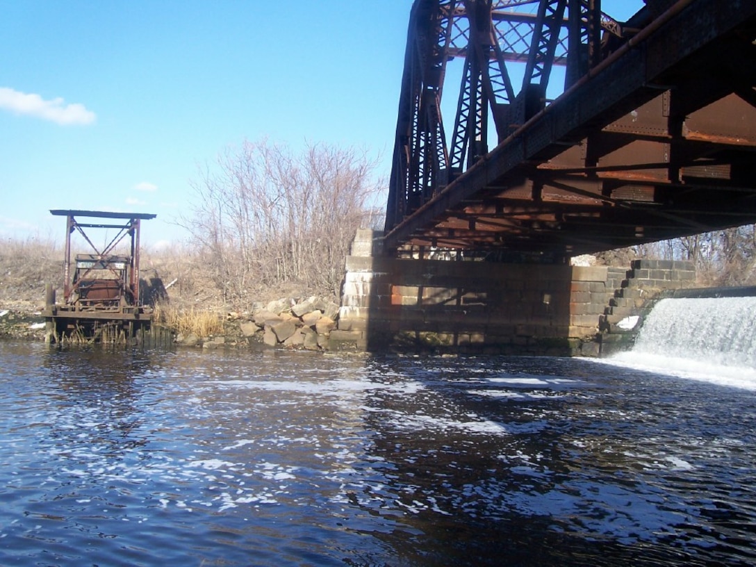 The fish ladder at Omega Pond Dam will be constructed near the right bank of the river, as part of the Ten Mile River Aquatic Ecosystem Restoration Project, which will restore diadromous fish migration to the lower Ten Mile River, East Providence, R.I., at the head of Narragansett Bay.