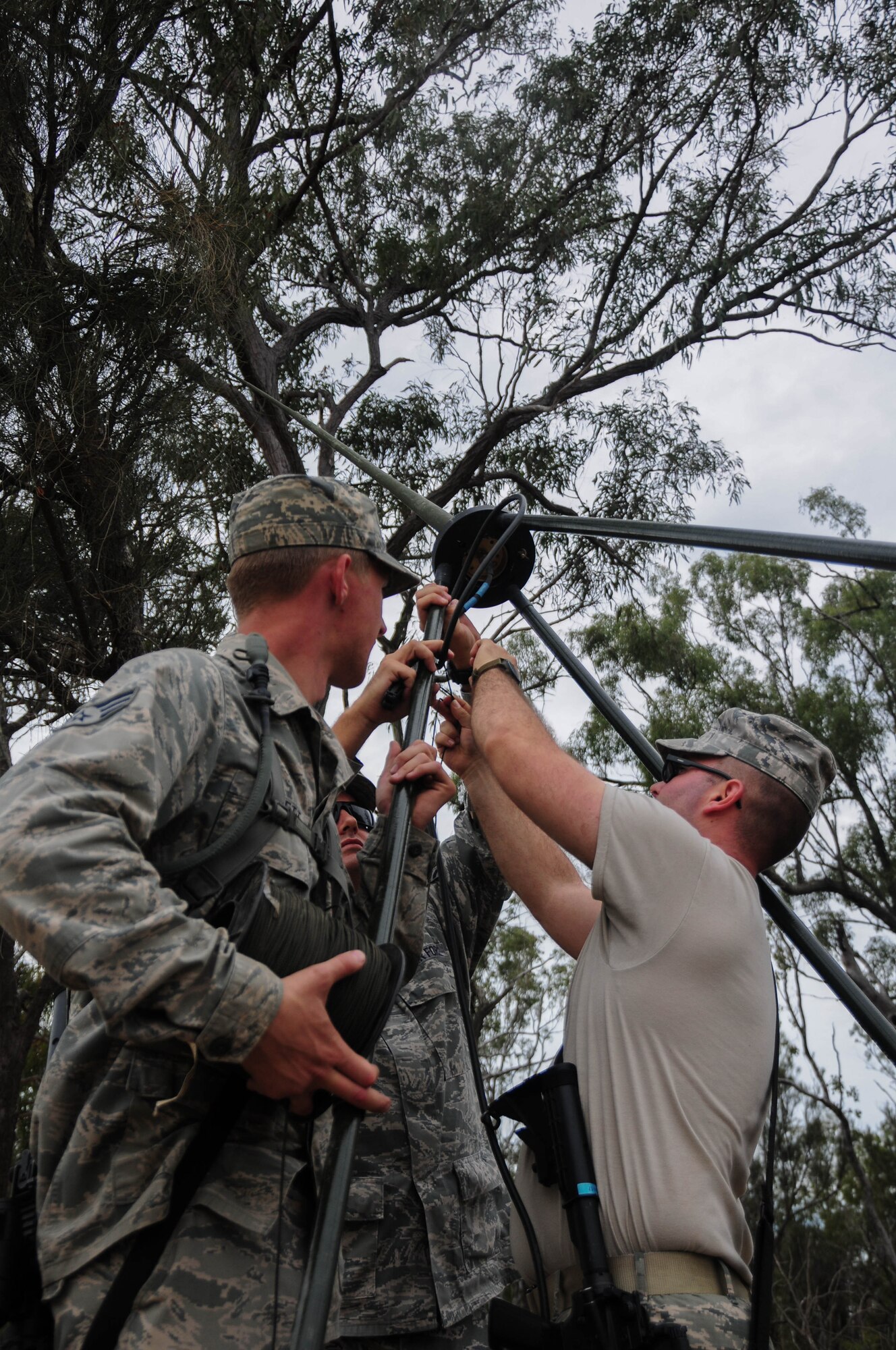 Airmen from the 36th Mobility Response Squadron set up an AN/PSC-5D Multi-Band, Multi-Mission Radio System at the airfield entry control point July 22, 2013, on Royal Australian Air Force Williamson Airfield, Australia, during Talisman Saber.  Seventy-one Airmen from the 36th Contingency Response Group returned to Andersen Air Force Base, Guam, after participating in this year’s Talisman Saber exercise. (U.S. Air Force photo by Airman 1st Class Marianique Santos/Released)