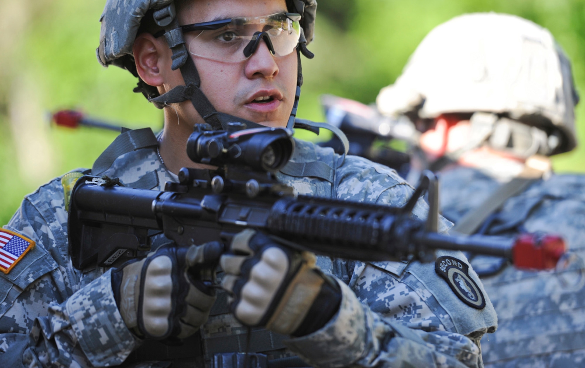 JOINT BASE ELMENDORF-RICHARDSON, Alaska -- Spc. Alejandro Carr, assigned to the 164th Military Police Company, 2d Engineer Brigade, a native of Royse City, Texas, participates in situational training exercise lanes during team qualifications at Joint Base Elmendorf-Richardson, Wednesday, July 24, 2013.  The military police Soldiers trained on various team-based scenarios aimed at testing their abilities to adapt to rapidly changing situations under stressful physical and mental conditions.   (U.S. Air Force photo/Justin Connaher)