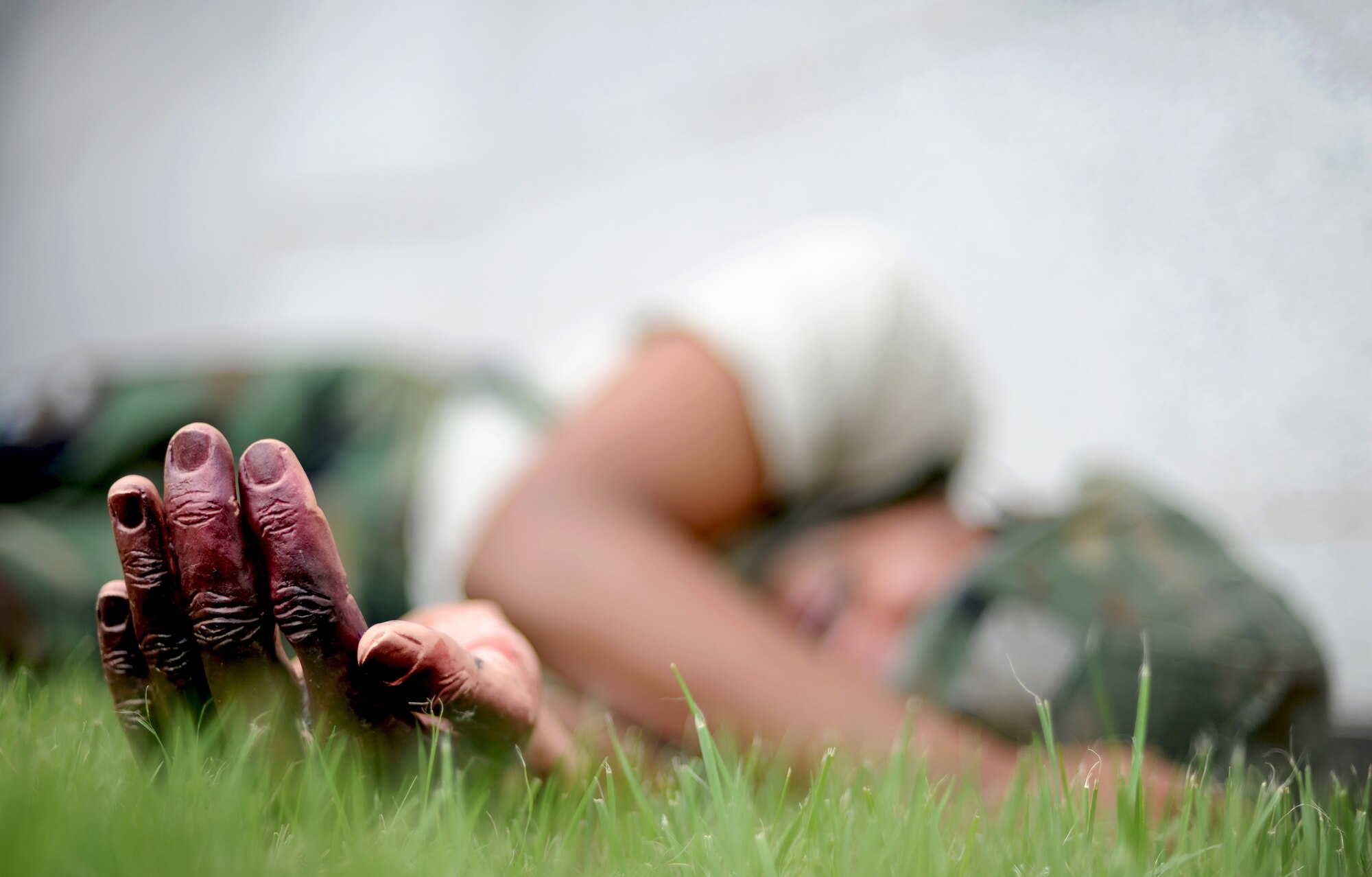 An Osan Airmen acts as a unconscious simulated mortar attack victim during Operational Readiness Exercise Beverly Midnight 13-03, Aug. 8, 2013. The wing executes military operations to beddown, maintain and employ follow-on forces for the combined arms base that includes three major flying tenants and large multiservice fighting units. (U.S. Air Force photo/Staff Sgt. Sara Csurilla)