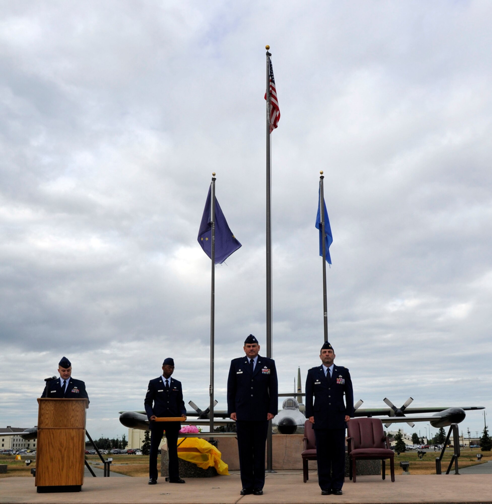 Air Force Col. David Stimac, 3rd Maintenance Group commander (left) and former 3rd Maintenance Operations Squadron commander Air Force Maj. Joseph Schmidt stood at attention during the inactivation ceremony of the 3rd Maintenance Operations Squadron at Heritage Park Aug. 5, 2013. The ceremony was hosted to commemorate the 3rd MOS and its redefinition as the 3rd Maintenance Operations Flight. (U.S. Air Force photo/Airman 1st Class Tammie Ramsouer)

