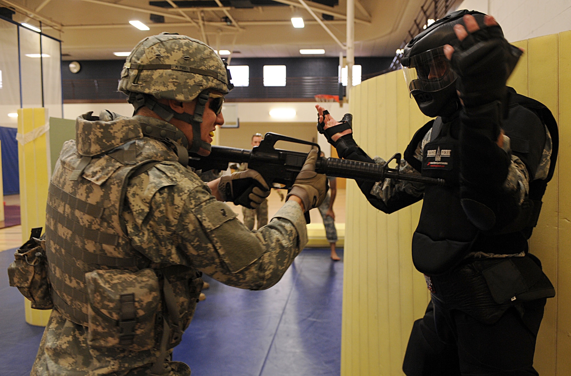 U.S. Army soldiers participate in the U.S. Army Basic Combatives Course at Davis-Monthan Air Force Base, Ariz., July 25, 2013. In the course, participants learned basic hand-to-hand combat techniques. The 40-hour course is scheduled to be taught once a quarter. Participants need to be present from beginning to end; thus, they would need to be released from their work centers for a week. (U.S. Air Force photo by Senior Airman Timothy Moore/Released)