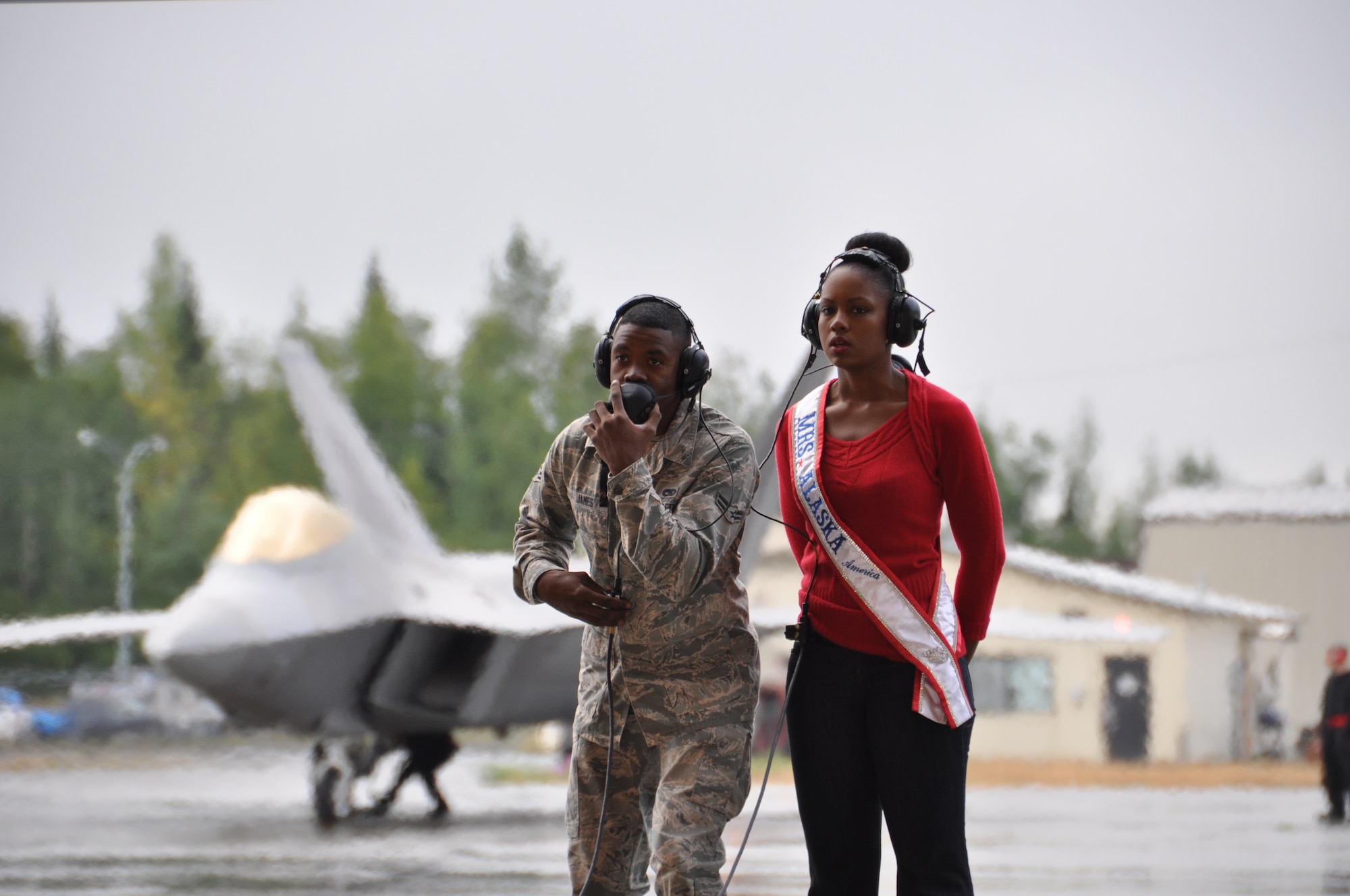 Airman 1st Class Jermaine James, 477th Aircraft Maintenance Squadron crew chief, launches an F-22 with his wife Gwynne here August 8. Gwynne took first place in the Mrs. Alaska pageant June 8. (U.S. Air Force/Tech. Sgt. Dana Rosso) 