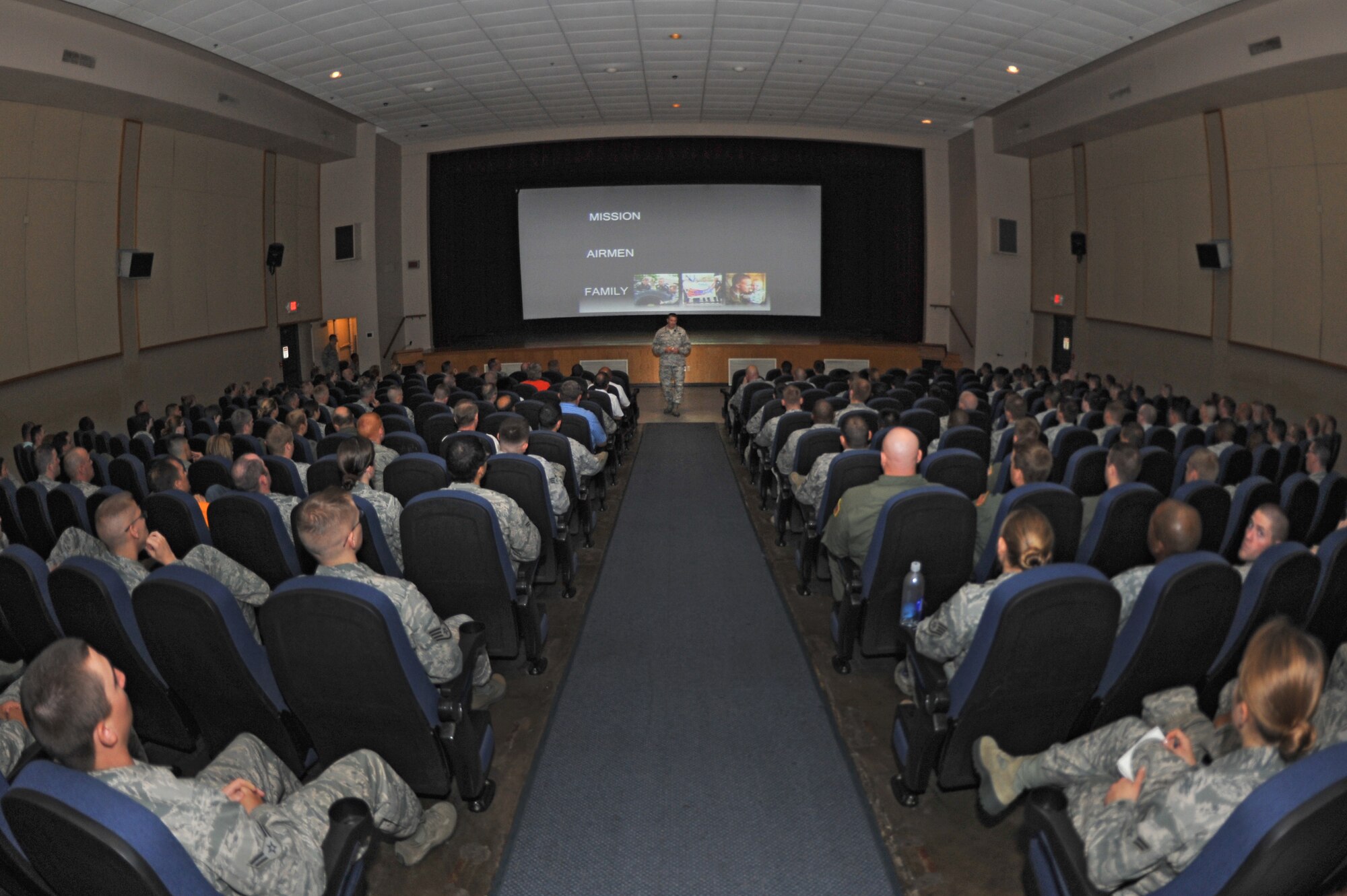 ALTUS AIR FORCE BASE, Okla. – Col. Bill Spangenthal, 97th Air Mobility Wing commander, speaks to Airmen during his first commander’s call at the base theater, Aug. 7. During the commander’s call Spangenthal talked to Airmen about his mission priorities in addition to the current Air Force issue of sexual assault among Airmen. His initial briefing for members of Altus AFB set mutual expectations as the wing continues its mission sets. (U.S. Air Force photo by Senior Airman Dillon Davis/Released)