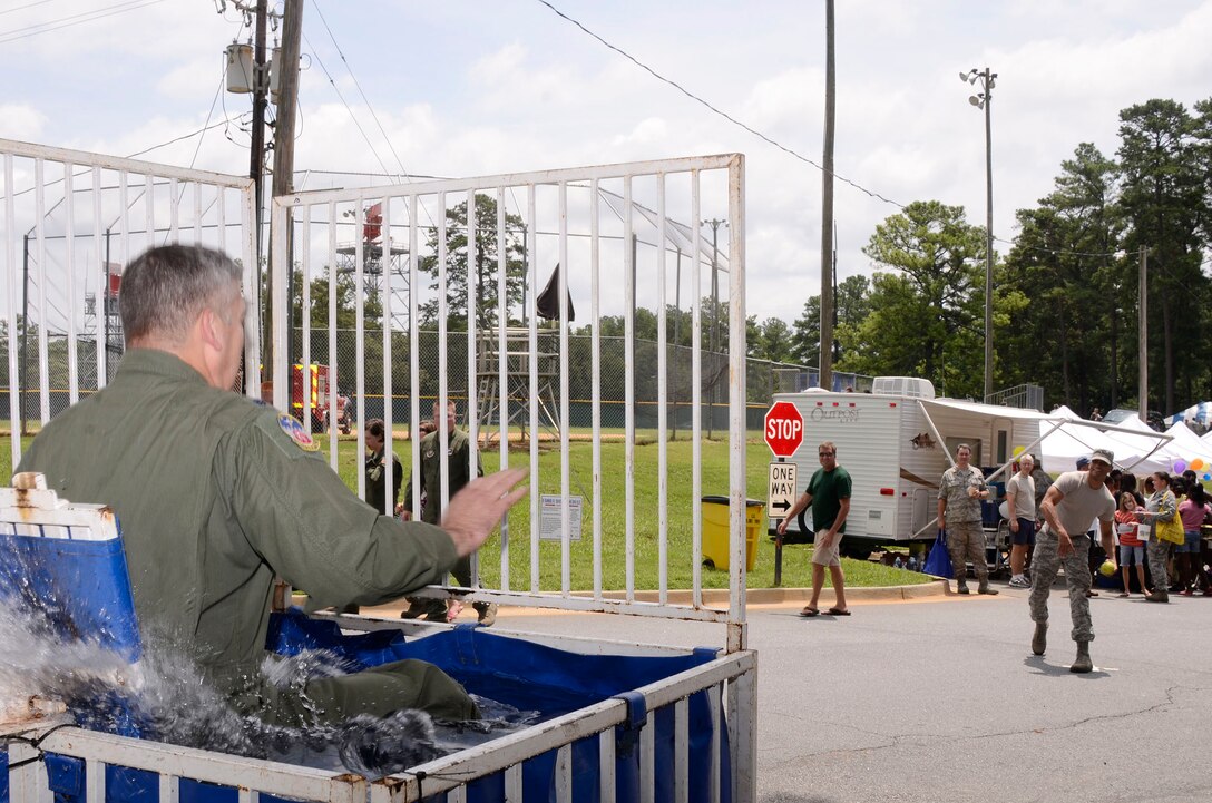 Lt. Col. Mark Cumbee, 700th Airlift Squadron commander is dunked during the 94th Airlift Wing Family Day at the Dobbins Lakeside Facility Aug. 4. (U.S. Air Force photo/Don Peek)
