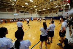 Airmen watch different squadrons compete in volleyball during the monthly Commander's Challenge Aug. 2, 2013, at the Fitness Center on Joint Base Charleston, S.C. (U.S, Air Force photo/Tech. Sgt. Douglas)