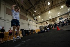 Senior Airman Nolan Ritter, 628th Logistics Readiness Squadron, performs burpees during a crossfit competition Aug.2, 2013, at the Fitness Center on Joint Base Charleston, S.C. The monthly Commander's Challenge consisted of a crossftt competition and volleyball game matches between squadrons. The monthly Commader's Challenge is a Wing initiative intended to encourage resident interaction and camaraderie as partof Comprehensive Airman Fitness. (U.S, Air Force photo/Tech. Sgt. Douglas)
