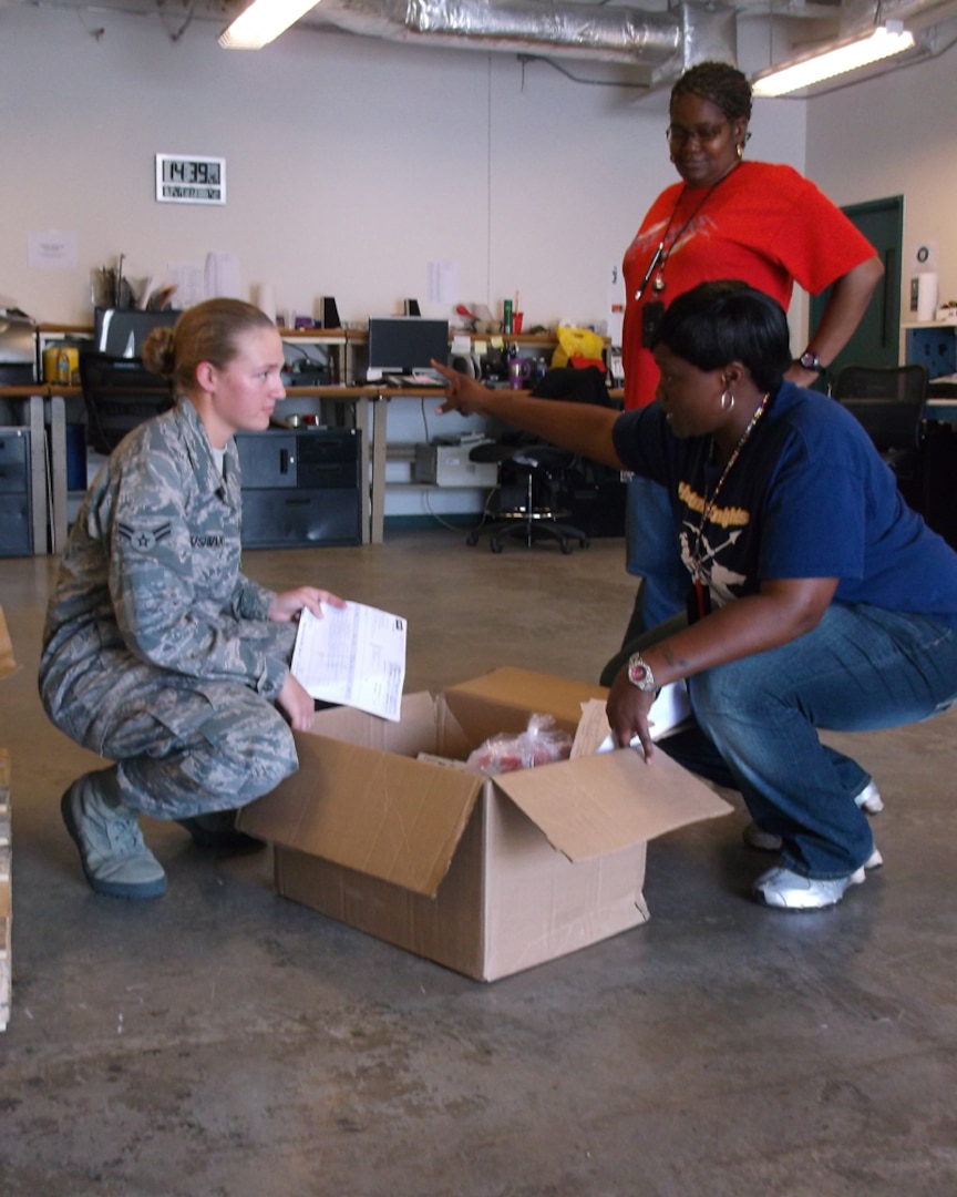 Seen here working with customers is Airman 1st Class Jamie Cushman, a medical logistics customer service representative assigned to the 937th Training Support Squadron at JBSA-Fort Sam Houston. Cushman scored 100 in the technical training medical logistics program before being assigned to the 937th TRSS. (AF Photo by Brian Davidson/Released)