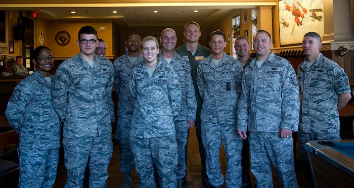 Joint Base Charleston first sergeants congratulate their Diamond Sharp award recipients Aug 6, 2013, at the Charleston Club, at JB Charleston – Air Base, S.C. The Diamond Sharp award winners were Airman 1st Class Michael Romack (2nd from left), 437th Aircraft Maintenance Squadron crew chief, Airman 1st Class Kyren Gantt (4th from left), 628th Security Forces Squadron patrolman, Senior Airman Amber Followill (5th from left), 437th Operations Support Squadron intelligence specialist, Airman 1st Class Robert Verlie (5th from right), 16th Airlift Squadron loadmaster, and Senior Airman Dawn Denton (4th from right), 628th Civil Engineer Squadron firefighter. Diamond Sharp awards are designed to recognize individuals in a unit who stand out to their first sergeant. (U.S. Air Force photo/Tech. Sgt. Rasheen Douglas)