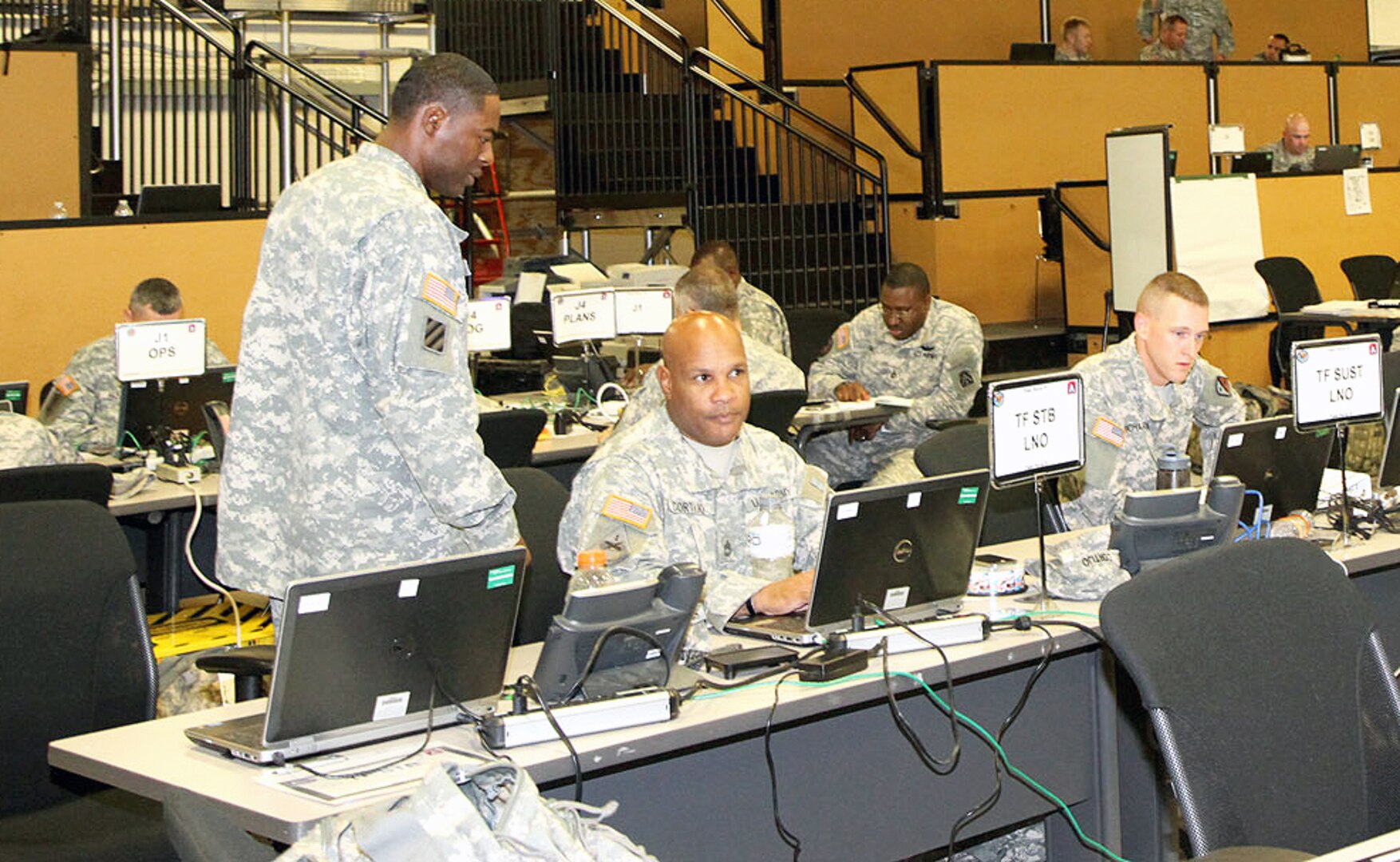 Liaison officers representing the various task forces in support of Task Force 51, U.S. Army North’s rapidly deployable task force, set up a joint operations center Aug. 1 in preparation of exercising their real-world mission capabilities during Vibrant Response 13-2 exercise. VR 13-2 is a major incident exercise conducted by U.S. Northern Command and led by Army North. (Photo by Staff Sgt. Corey Baltos)