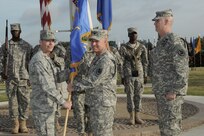 Brig. Gen. Bob LaBrutta (left), commander of the 502nd Air Base Wing and Joint Base San Antonio, passes the 502nd Mission Support Group colors to incoming 502nd MSG commander Col. Steven A. Toft, as outgoing commander Col. John P. Lamoureux (right) looks on. Lamoureux is leaving the 502nd MSG to become commander of the Dwight D. Eisenhower Army Medical Center at Fort Gordon, Ga. (Photo by Mike O'Rear, JBSA-Fort Sam Houston Visual Information)
