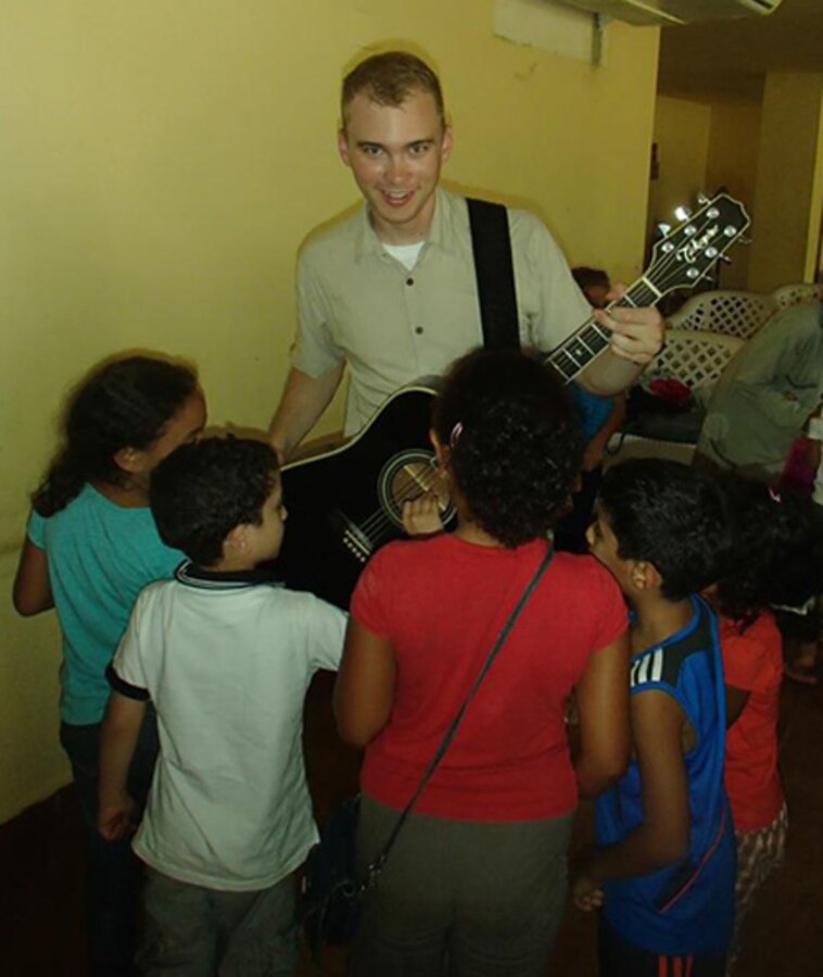 SSgt Doug Filipek talks to children at a day school in Alexandria, Egypt.

photo courtesy of TSgt Andy Morys