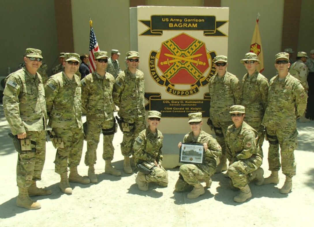 Rock Band members deployed to Afghanistan were presented with a plaque by the command of Bagram Air Base.