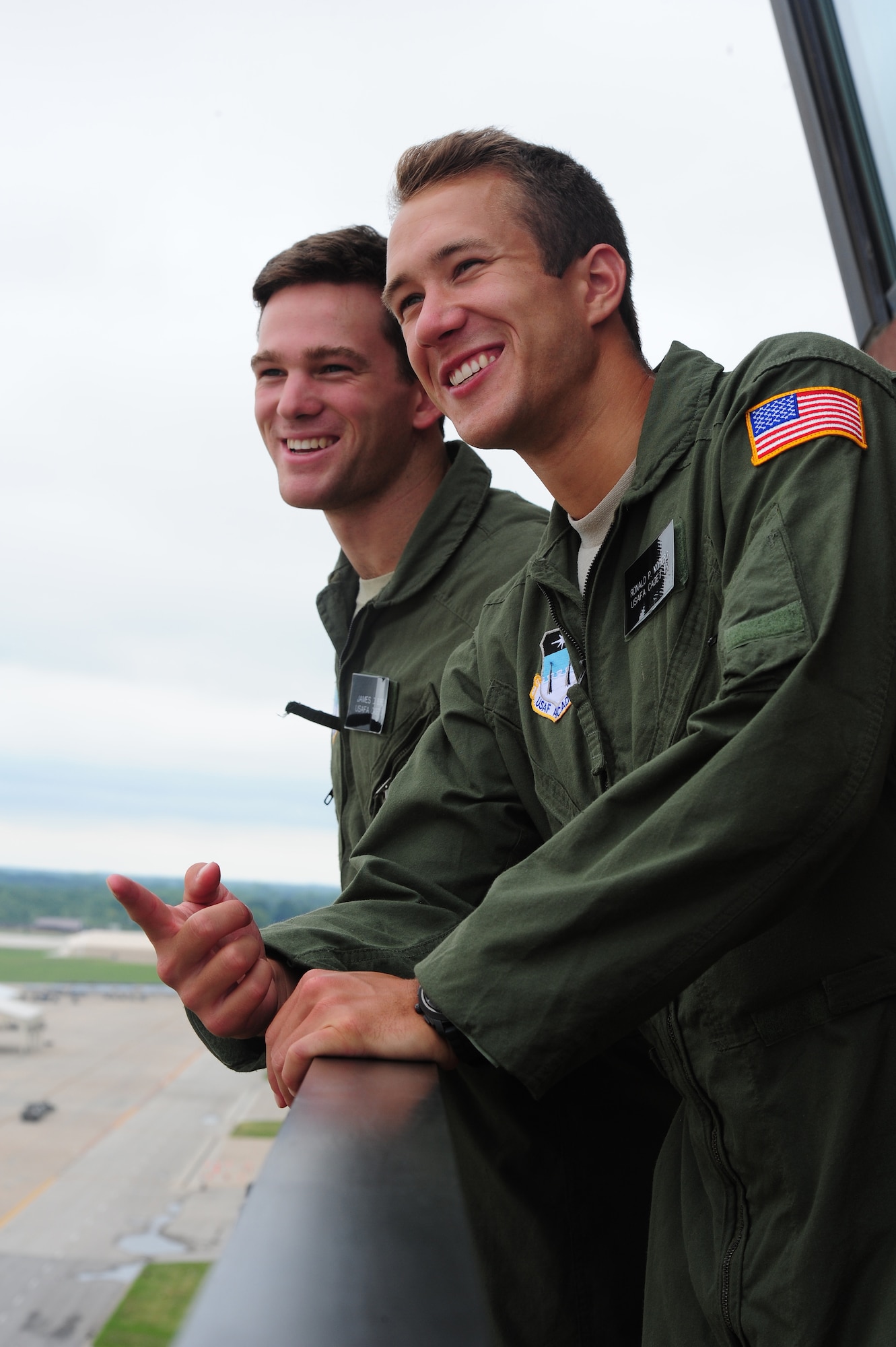 U.S. Air Force Academy cadets James Burke and Ronald Moberg share a laugh during a tour of the air traffic control tower at Whiteman Air Force Base, Mo., July 30, 2013. Burke, Moberg and several other cadets toured the control tower and other organizations on base as part of Operation Air Force, which is designed to give cadets a better understanding of how the Air Force completes various missions. (U.S. Air Force photo by Staff Sgt. Nick Wilson/Released)