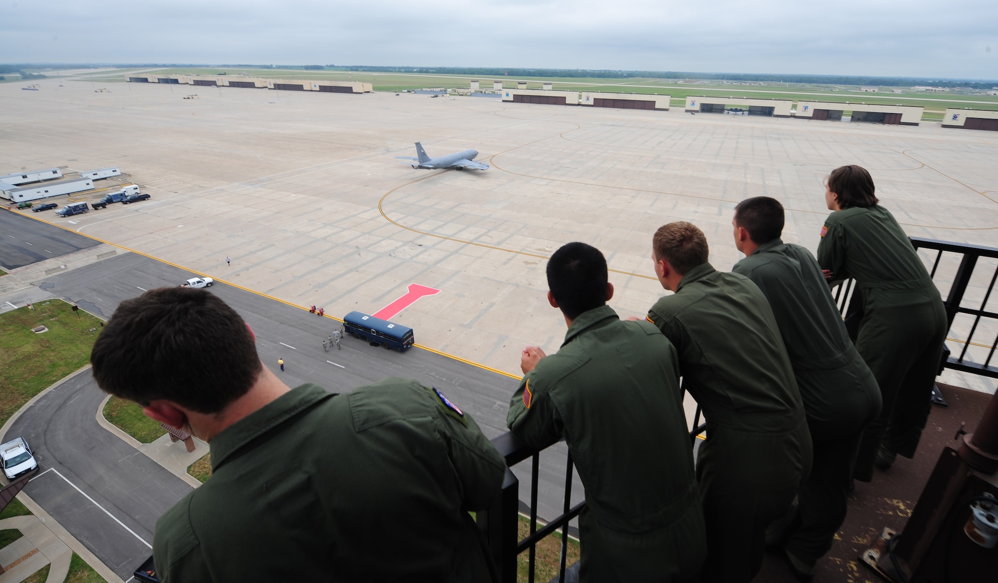 Cadets from the U.S. Air Force Academy watch a K-35R taxi the flightline from the catwalk of the air traffic control tower at Whiteman Air Force Base, Mo., July 30, 2013. The cadets toured the base as part of Operation Air Force, which allows cadets to familiarize themselves with missions of operational Air Force bases. (U.S. Air Force photo by Staff Sgt. Nick Wilson/Released)