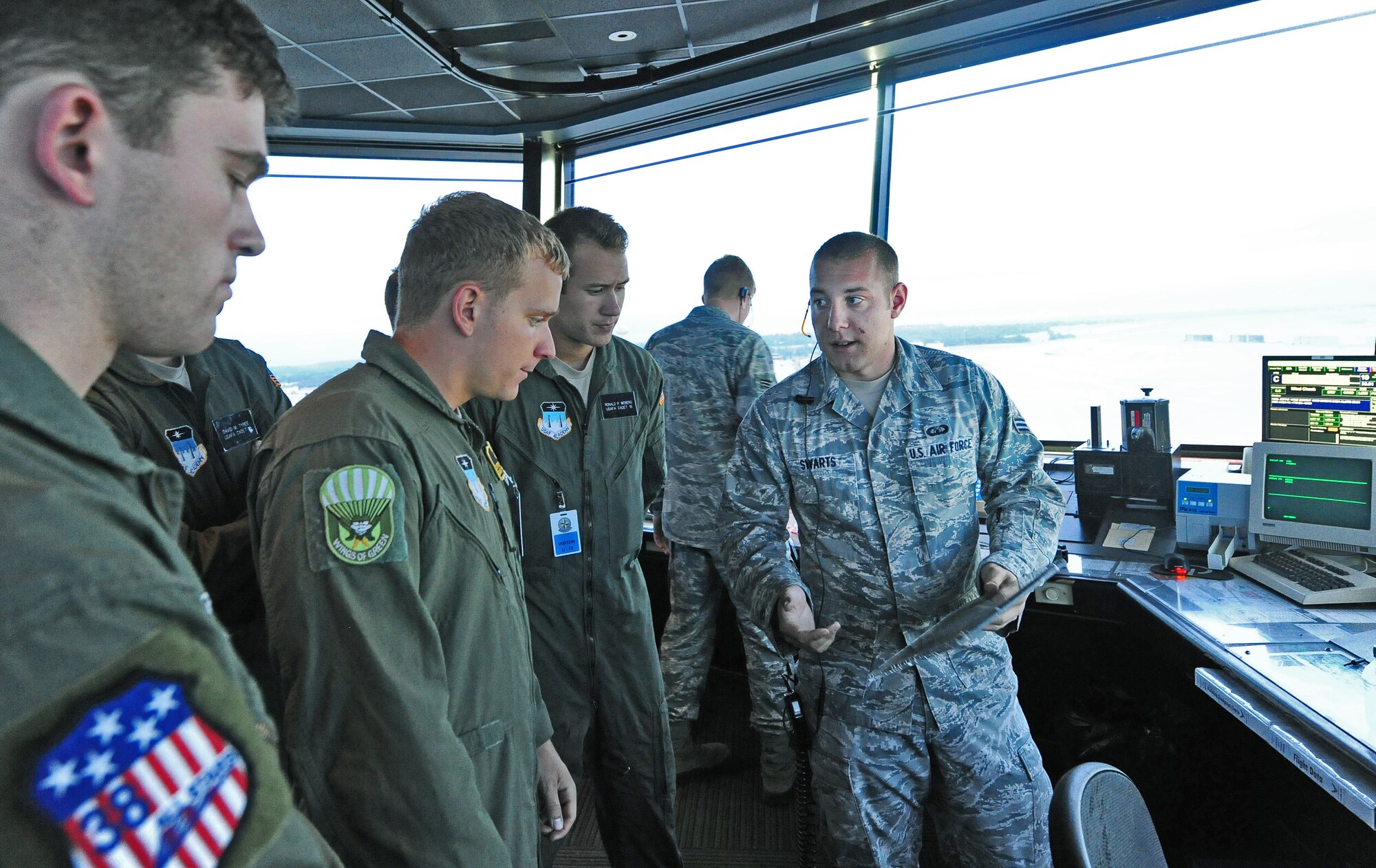 U.S. Air Force Senior Airman Kody Swarts, 509th Operations Support Squadron air traffic controller, gives a tour of the control tower to cadets from the U.S. Air Force Academy as part of Operation Air Force at Whiteman Air Force Base, Mo., July 30, 2013. Operation Air Force is a program that gives Air Force Academy cadets a first-hand experience of operational Air Force bases. (U.S. Air Force photo by Staff Sgt. Nick Wilson/Released)