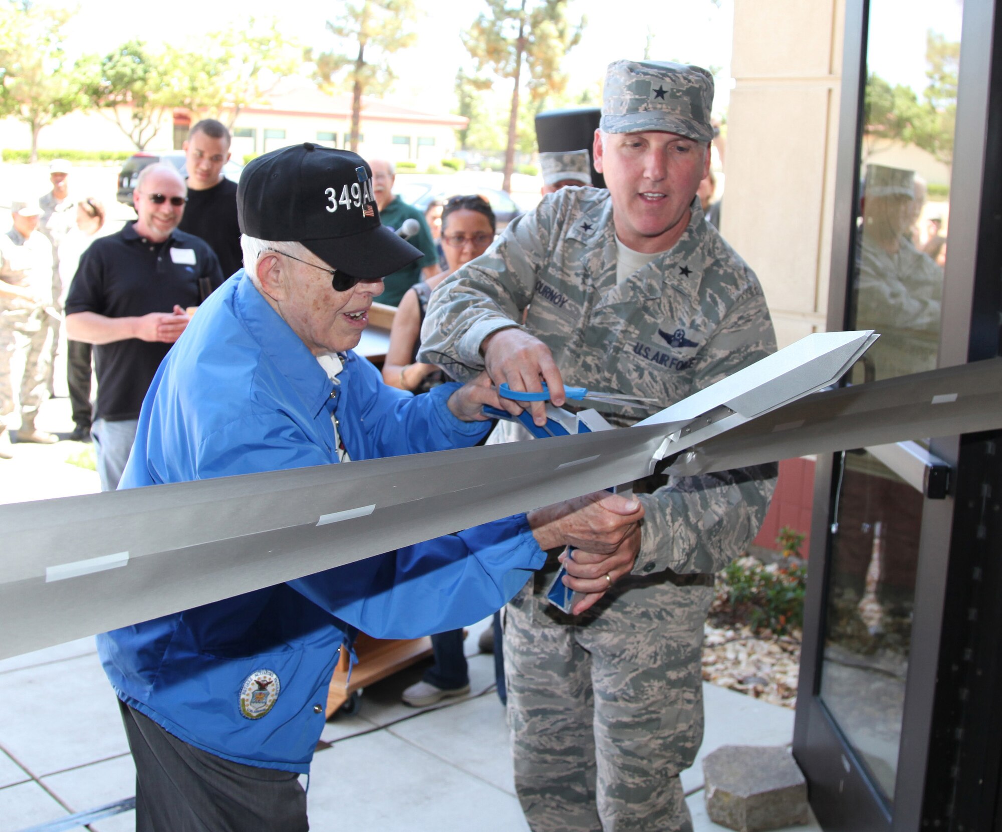 TRAVIS AIR FORCE BASE, Calif. -- Joe Rowen, in blue jacket, speaks with Chuck Egiziano (left) and John Conboy during 349th Alumni Day, June 2, 2012 at Travis Air Force Base, Calif., when current and past members of the 349th Air Mobility Wing reinforced the wing's proud heritage and commitment to excellence.  The day's events included the ribbon cutting ceremony for the Heritage Hall in the Wing Headquarters; a BBQ lunch sponsored by the 349th Chiefs Group, the 349th Officer's Spouses Club and Mr. Stanley Davis; and a static display tour of a C-17 Globemaster III.  The day's festivities cumulated with a banquet featuring remarks by Brig. Gen. Dale R. Baumler, former 349 AMW and 14th Air Force commander; and by Brig. Gen. John C. Flournoy, Jr., current 349 AMW commander; and music by the Band of the Golden West. (U.S. Air Force photo / Lt. Col. Robert Couse-Baker)