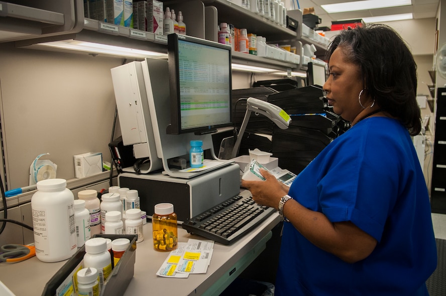 Dianne Holloway, 23d Medical Group pharmacy technician, performs prescription refills at Moody Air Force Base, Ga., Aug. 5, 2013. All refills are sent to the Moody Base Exchange pharmacy, reducing wait times at the main pharmacy. (U.S. Air Force photo by Airman 1st Class Sandra Marrero/released)
