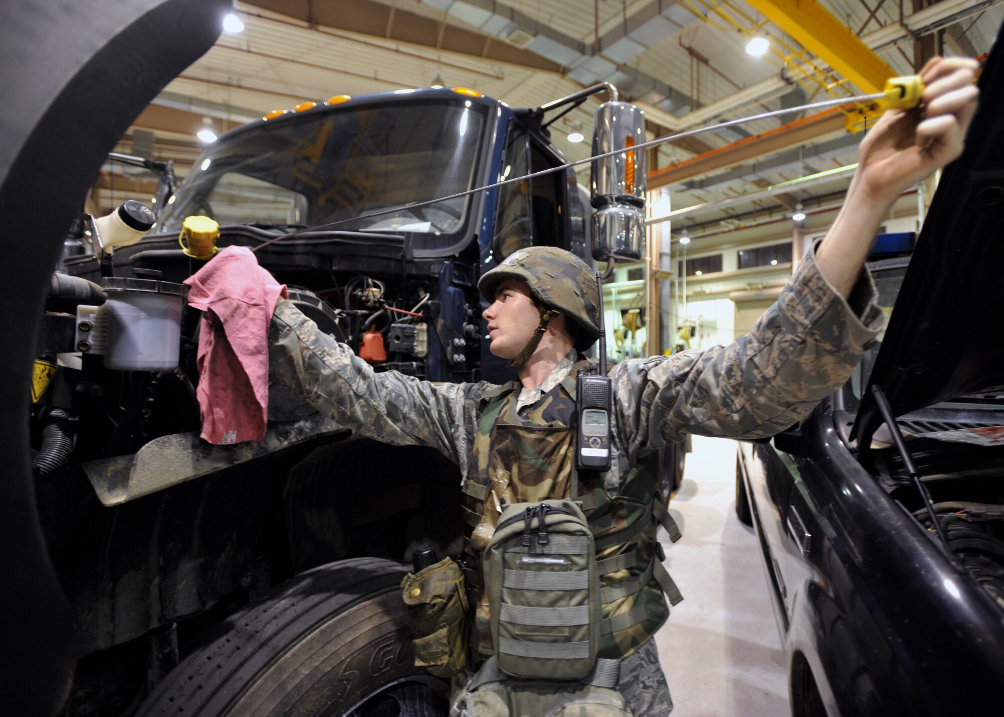 Senior Airman Sean Collins, 51st Logistics Readiness Squadron vehicle maintenance technician, checks the oil of a vehicle during Operational Readiness Exercise Beverly Midnight 13-03 at Osan Air Base, Republic of Korea, Aug. 9, 2013. The exercise highlights Osan Airmen’s ability to position, employ and sustain forces, and showcase operational readiness during contingency operations. (U.S. Air Force photo/Senior Airman Siuta B. Ika)