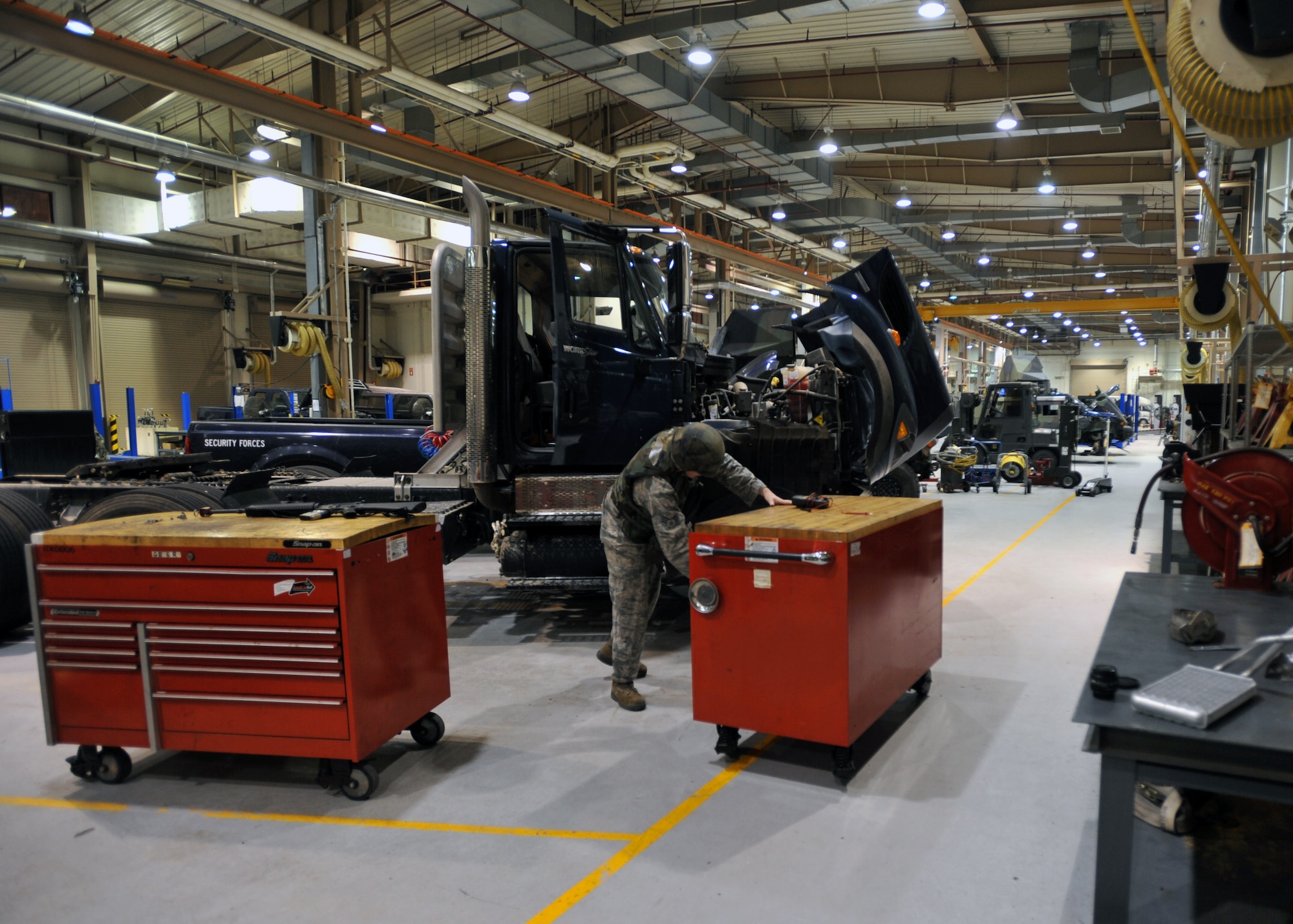 Senior Airman Sean Collins, 51st Logistics Readiness Squadron vehicle maintenance technician, searches for a tool during Operational Readiness Exercise Beverly Midnight 13-03 at Osan Air Base, Republic of Korea, Aug. 9, 2013. VM techs like Collins are charged with keeping the 51st Fighter Wing’s entire vehicle fleet up and running. (U.S. Air Force photo/Senior Airman Siuta B. Ika)
