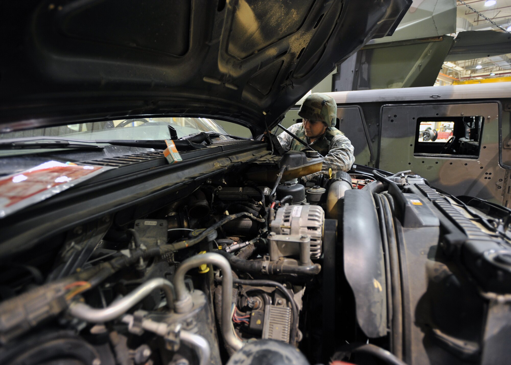 Senior Airman Michael Geer, 51st Logistics Readiness Squadron vehicle maintenance technician, inspects a vehicle part during Operational Readiness Exercise Beverly Midnight 13-03 at Osan Air Base, Republic of Korea, Aug. 9, 2013. Osan Airmen are in the fourth simulated wartime contingency exercise executed in 2013 that will test the base's ability to defend and execute the mission in a heightened state of readiness. (U.S. Air Force photo/Senior Airman Siuta B. Ika)