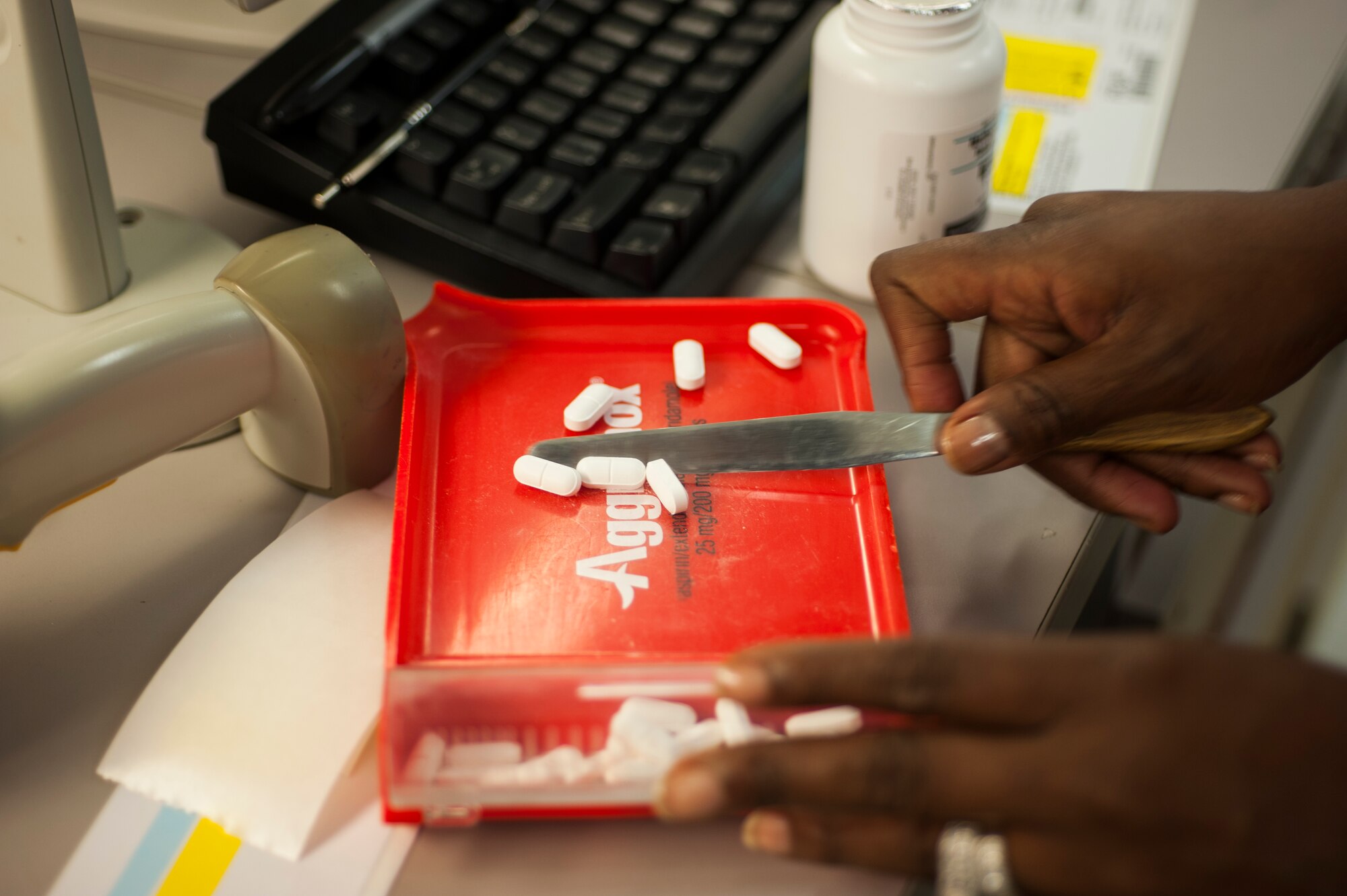 A 23d Medical Group pharmacy technician counts tablets using a tray and spatula at Moody Air Force Base, Ga., Aug. 5, 2013. Before tablets can be counted, medication bottles are scanned to ensure it matches the prescription. (U.S. Air Force photo by Airman 1st Class Sandra Marrero/released)
