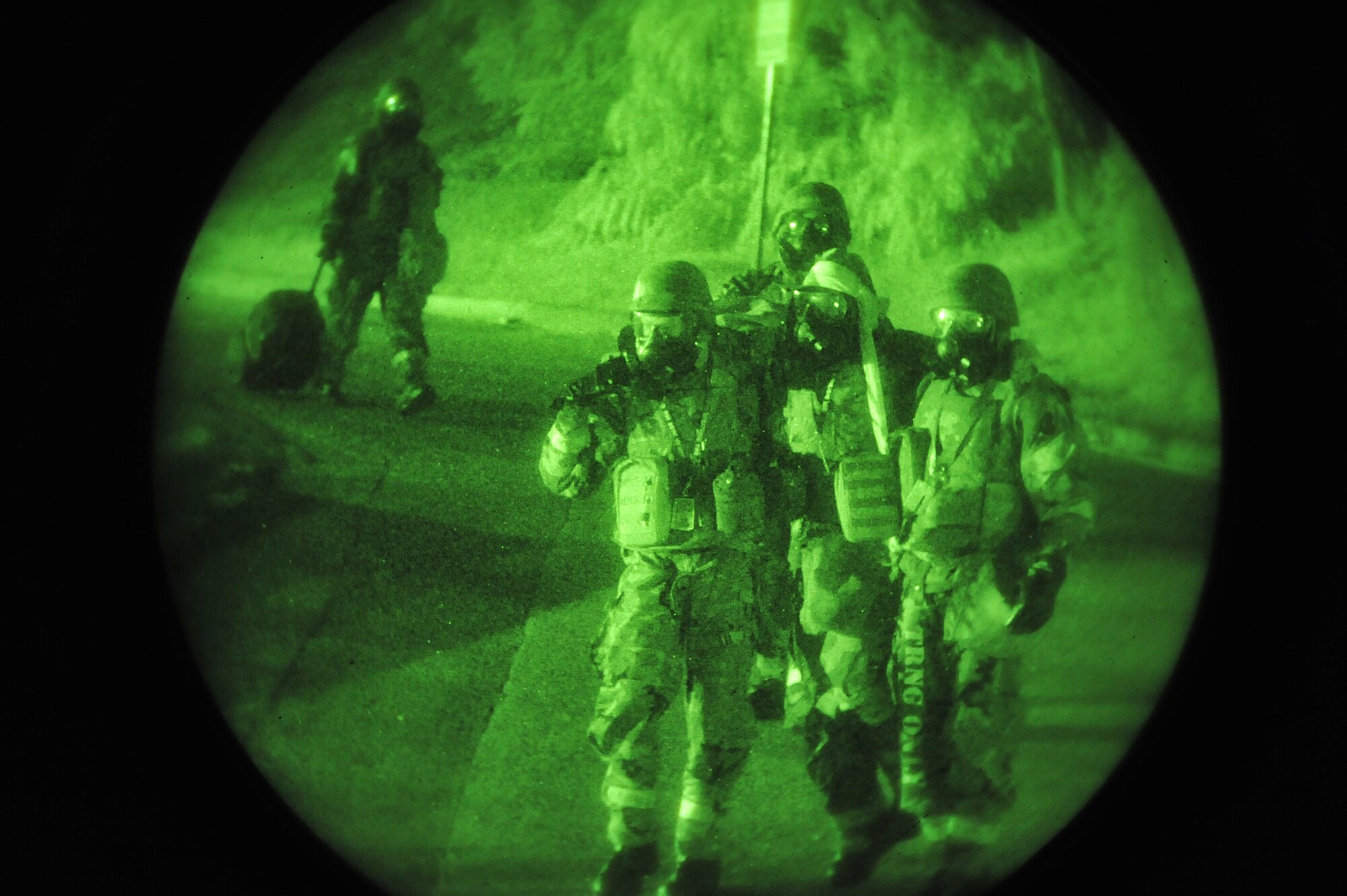 Emergency operations evacuees help an injured airman during a ‘bug out’ scenario during Operational Readiness Exercise Beverly Midnight 13-03 at Osan Air Base, Republic of Korea, Aug. 8, 2013. Airmen don Mission Oriented Protective Posture gear in wartime following an attack when contamination is present or suspected or when the highest level of protection is required. (U.S. Air Force photo/Staff Sgt. Emerson Nuñez)