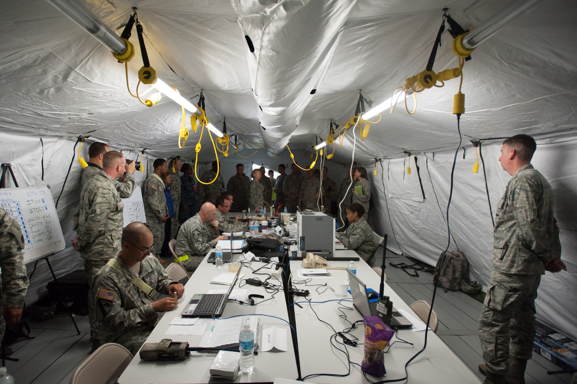 Maj. Gen. Barbara Faulkenberry, vice commander of 18th Air Force, visits the Joint Operations Center tent during Exercise Gateway Relief at MidAmerica St. Louis Airport in Mascoutah, Ill., on Aug. 7, 2013. The Kentucky Air National Guard's 123rd Contingency Response Group and the U.S. Army’s 689th Rapid Port Opening Element in Fort Eustis, Va., have teamed up for the U.S. Transportation Command-directed exercise through Aug. 9, executing the reception and distribution of earthquake-relief supplies. (U.S. Air National Guard photo by Maj. Dale Greer)