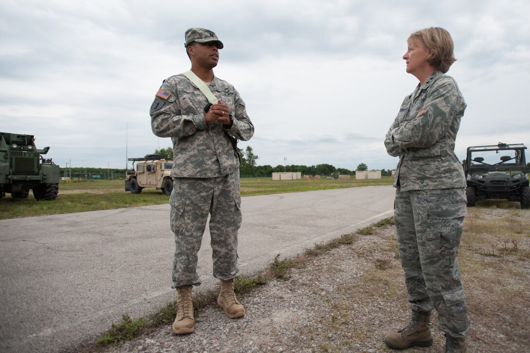 Army Capt. Charles Greene, commander of the U.S. Army’s 689th Rapid Port Opening Element, discusses cargo movement operations with Maj. Gen. Barbara Faulkenberry, vice commander of 18th Air Force, during Exercise Gateway Relief at MidAmerica St. Louis Airport in Mascoutah, Ill., on Aug. 7, 2013.  The exercise is designed to test the ability of the 689th and the Kentucky Air National Guard’s 123rd Contingency Response Group ability to stand up and operate a Joint Task Force-Port Opening, which receives relief supplies by airlift and stages them for movement over land. (U.S. Air National Guard photo by Maj. Dale Greer)