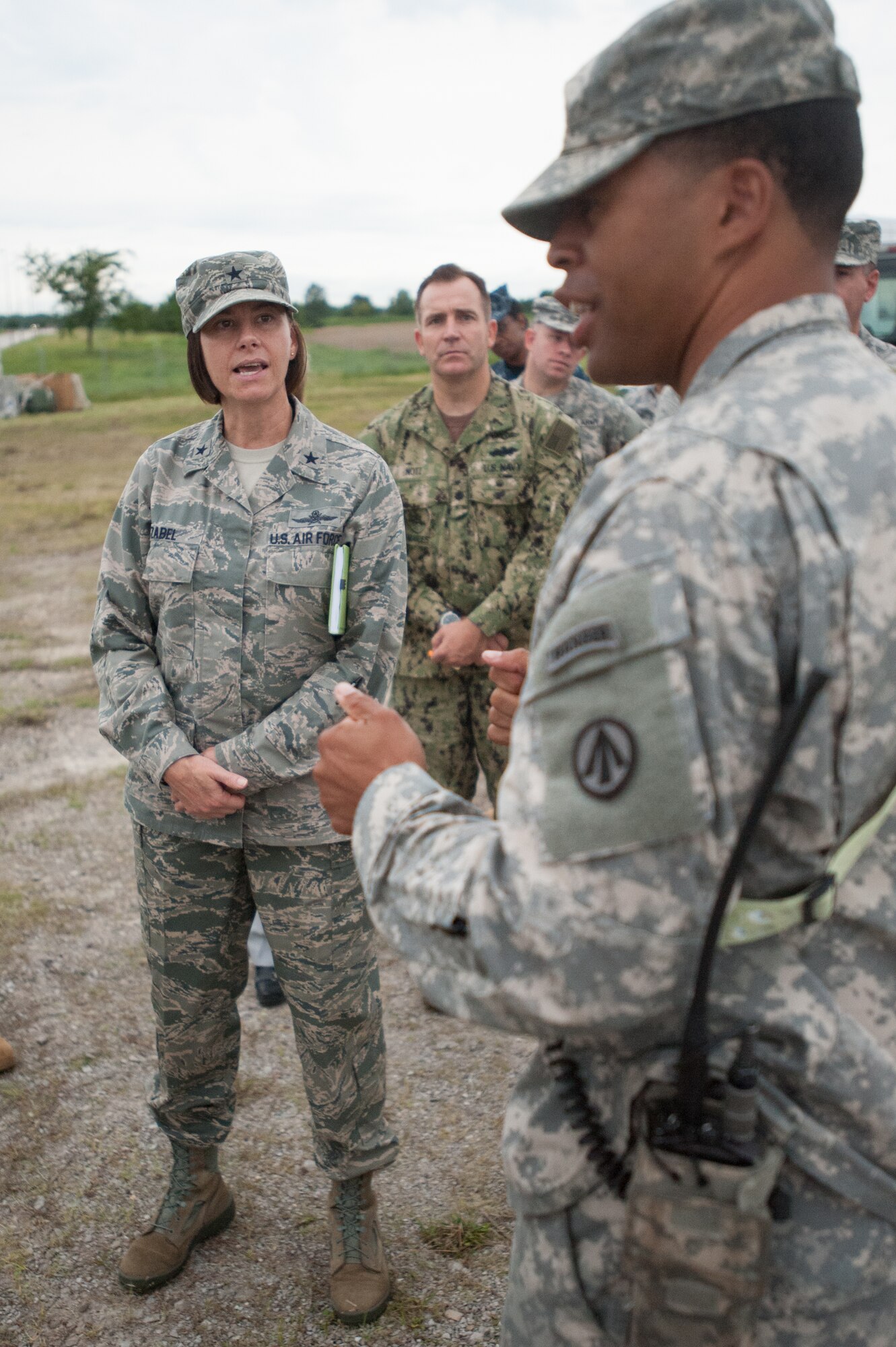 Army Capt. Charles Greene, commander of the U.S. Army’s 689th Rapid Port Opening Element, discusses cargo movement operations with Brig. Gen. Sarah Zabel, director of command, control, communications and Ccyber systems at U.S. Transportation Command, during Exercise Gateway Relief at MidAmerica St. Louis Airport in Mascoutah, Ill., on Aug. 7, 2013.  The exercise is designed to test the ability of the 689th and the Kentucky Air National Guard’s 123rd Contingency Response Group ability to stand up and operate a Joint Task Force-Port Opening, which receives relief supplies by airlift and stages them for movement over land. (U.S. Air National Guard photo by Maj. Dale Greer)