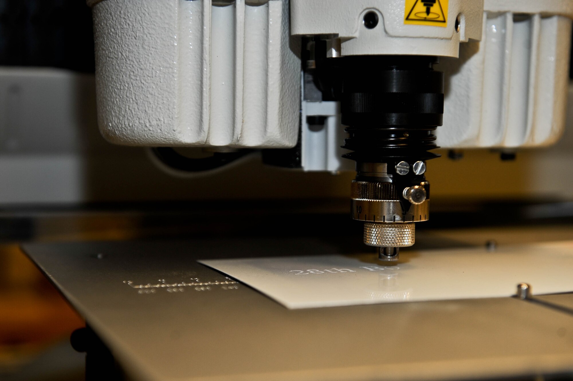 The Arts and Crafts Skills Development Center on Ellsworth Air Force Base has two versions of engraving machines, diamond tipped (shown) and a laser engraver to provide a more versatile option for engraving on different. The Arts and Crafts Center is able to create a wide variety of custom pieces for almost any occasion, open from 8:30 a.m. to 4:30 p.m. Monday through Thursday and 8:30 a.m. to 2 p.m. on Fridays. (U.S. Air Force photo by Airman 1st Class Rebecca Imwalle/Released)
