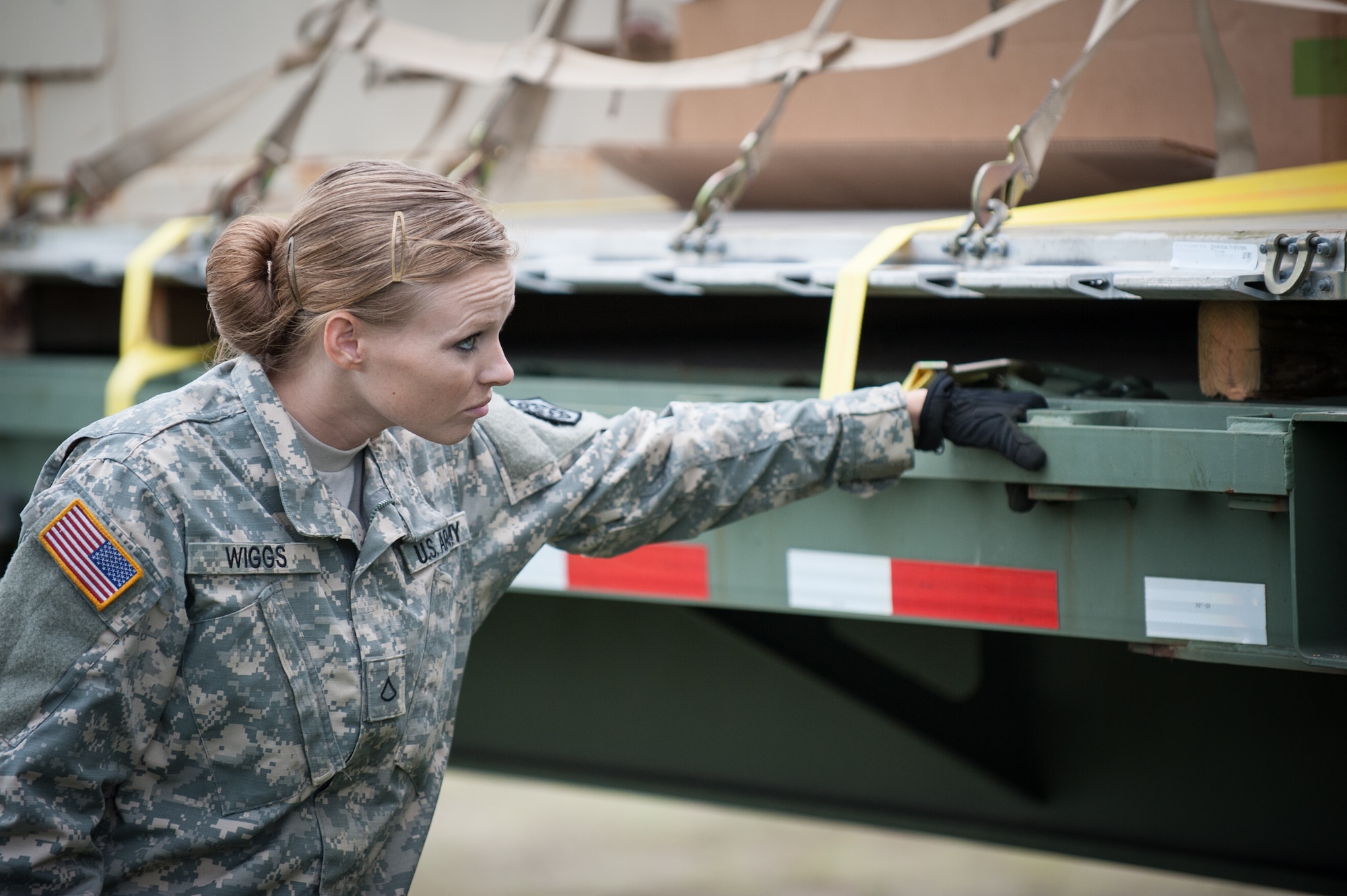 Army Pfc. Loura Wiggs, a transportation specialist with the U.S. 689th Army’s Rapid Port Opening Element in Fort Eustis, Va., directs the placement of a pallet of disaster-relief supplies onto a flat-bed truck at MidAmerica St. Louis Airport in Mascoutah, Ill., on Aug. 7, 2013, as part of Exercise Gateway Relief, a U.S. Transportation Command-directed earthquake-response scenario. Wiggs was working at the forward node of a Joint Task Force-Port Opening, where relief supplies that arrive by air are staged for further movement over land by trucks.
The Kentucky Air National Guard's 123rd Contingency Response Group operated the airlift side of the JTF-PO, known as an Aerial Port of Debarkation. (U.S. Air National Guard photo by Maj. Dale Greer)