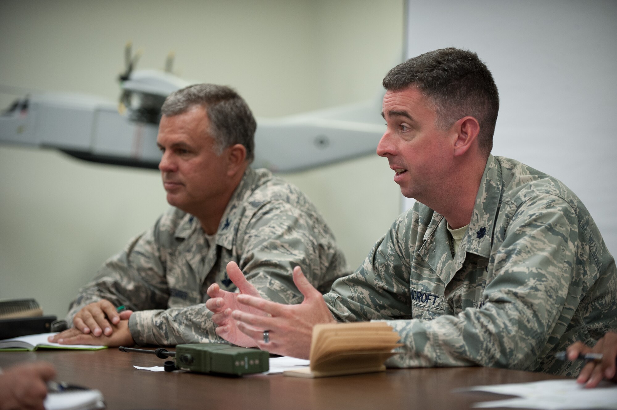 Lt. Col. Bruce Bancroft (right), director of the Joint Operations Center for Exercise Gateway Relief, and Col. Mark Heiniger, commander of the Kentucky Air National Guard’s 123rd Contingency Response Group, brief notional representatives from the Federal Emergency Management Agency at MidAmerica St. Louis Airport in Mascoutah, Ill., on Aug. 7, 2013. The 123rd is teaming up with the U.S. Army’s 689th Rapid Port Opening Element from Fort Eustis, Va., through Aug. 9, to execute the earthquake-response scenario, providing for the reception and distribution of disaster-relief supplies. (U.S. Air National Guard photo by Maj. Dale Greer)