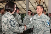 HANSCOM AIR FORCE BASE, Mass. -- Newly selected Staff Sgt. Matthew Ramos, C3I and Networks Directorate knowledge operations manager, is congratulated by Chief Master Sgt. Cindy Rainey, 66th Medical Squadron superintendent, during the Staff Sergeant Promotion Release Celebration at the Minuteman Commons Aug. 1. Ramos was among more than 20 senior airman notified of their selection at Hanscom. (U.S. Air Force photo by Walter Santos)