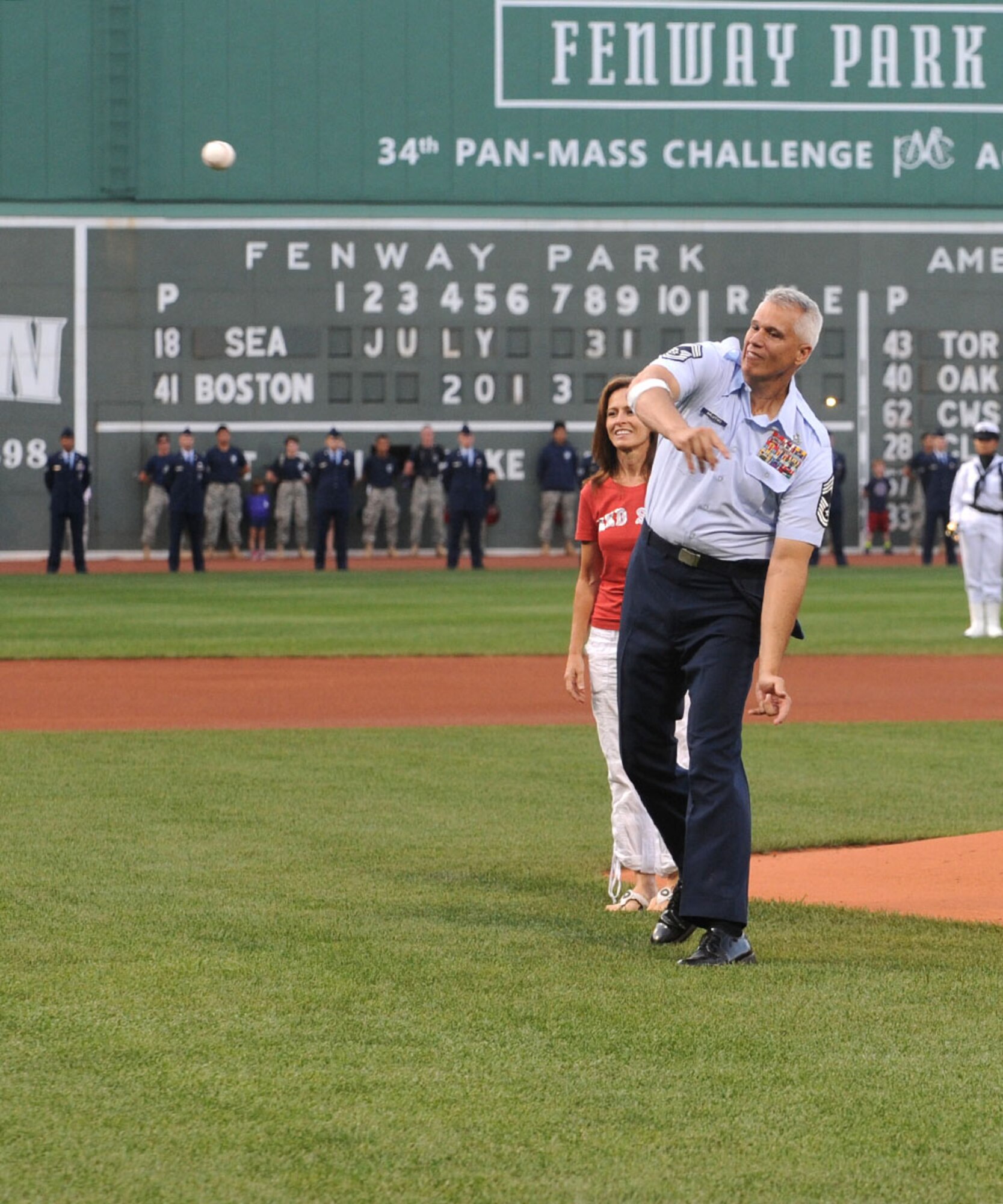 BOSTON - Chief Master Sgt. Mitchell Balutski, Hanscom Air Force Base senior enlisted advisor, throws out the ceremonial first pitch during a Boston Red Sox game on July 31 at Fenway Park. Balutski, who is Hawaiian and will be retiring this fall, threw the first pitch to Shane Victorino who is also from Hawaii. (Courtesy photo)