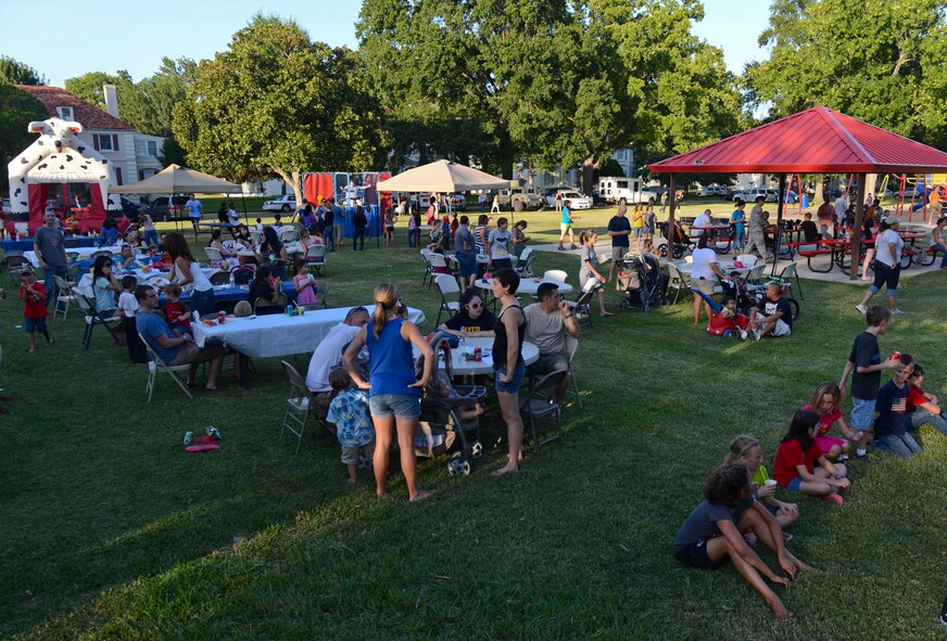 Airmen and their families gather to celebrate National Night Out on Barksdale Air Force Base, La., Aug. 6, 2013. The event is part of a year-long campaign designed to increase the awareness of crime and drug prevention, and generate support for local anti-crime programs. It is also used to strengthen neighborhood spirit and police-community partnerships, and send a message letting criminals know that neighborhoods are organized and fighting back. (U.S. Air Force photo/Senior Airman Micaiah Anthony)
