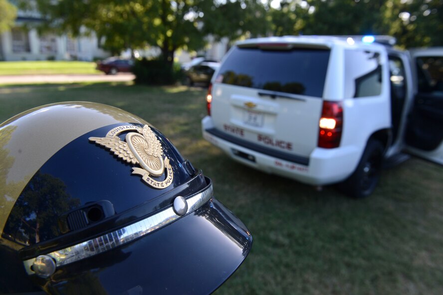 A Louisiana State Police helmet rests on a motorcycle during National Night Out on Barksdale Air Force Base, La., Aug. 6, 2013. Members from the Louisiana State Police, Shreveport City Marshalls, Bossier Parish Sheriff's Office and the Caddo Parish Sheriff Crime Prevention Office came to the event to show community support and to raise awareness of crime and drug prevention. (U.S. Air Force photo/Senior Airman Micaiah Anthony)