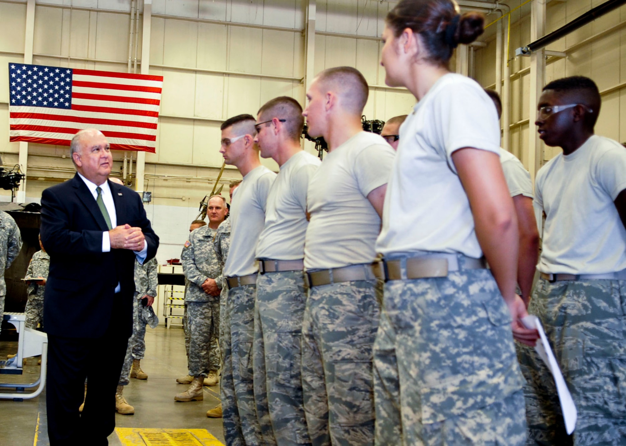 Under Secretary of the Army Joseph W. Westphal talks with Soldiers and Airmen from a Blackhawk Helicopter maintenance class inside one of the 128th Aviation Brigade's training hangars at Fort Eustis, Va., August 7, 2013. During his tour of the schoolhouse, Westphal talked to students and instructors about their training program and facilities. (U.S. Air Force photo by Staff Sgt. Wesley Farnsworth/Released)
