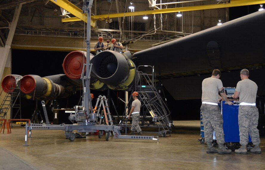 Airmen from the 2nd Maintenance Squadron work on a B-52H Stratofortress in the Phase Hangar on Barksdale Air Force Base, La., Aug. 5, 2013. Shift workers help complete Barksdale's round-the-clock flying mission and work through the night to launch, recover and repair the B-52. (U.S. Air Force photo/Staff Sgt. Amber Corcoran)