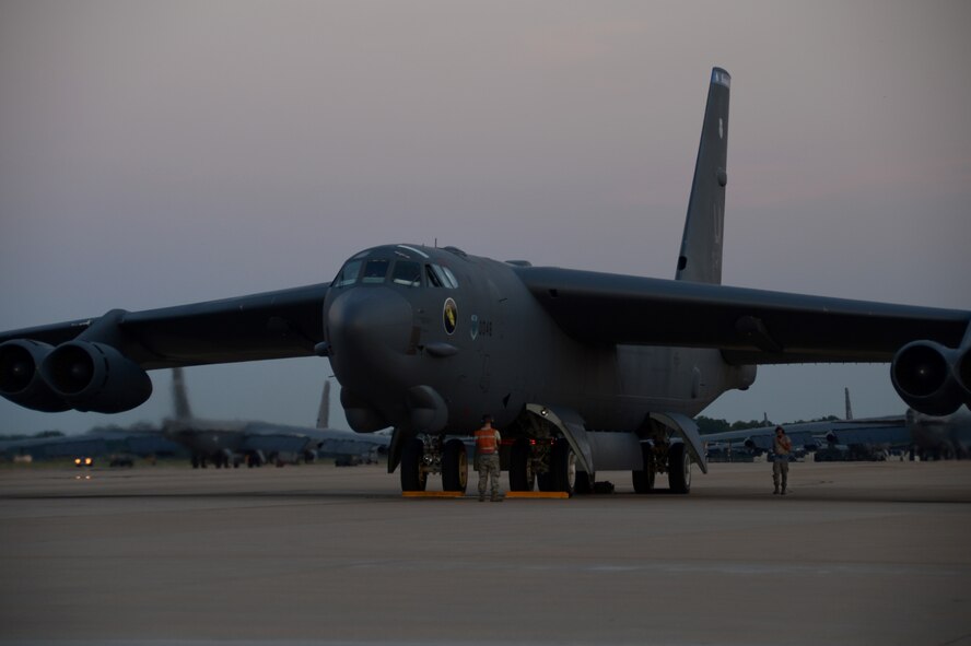 Airman 1st Class Christian Dupree, right, and Senior Airman Broden McDonald, both 20th Aircraft Maintenance Unit crew chiefs, prepare a B-52H Stratofortress for take-off on the flightline at Barksdale Air Force Base, La., Aug. 5, 2013. The mission of the 2nd Bomb Wing's bomber fleet is 24-hours a day, so flightline maintainers work shifts round-the-clock to keep the mission going. (U.S. Air Force photo/Staff Sgt. Amber Corcoran)