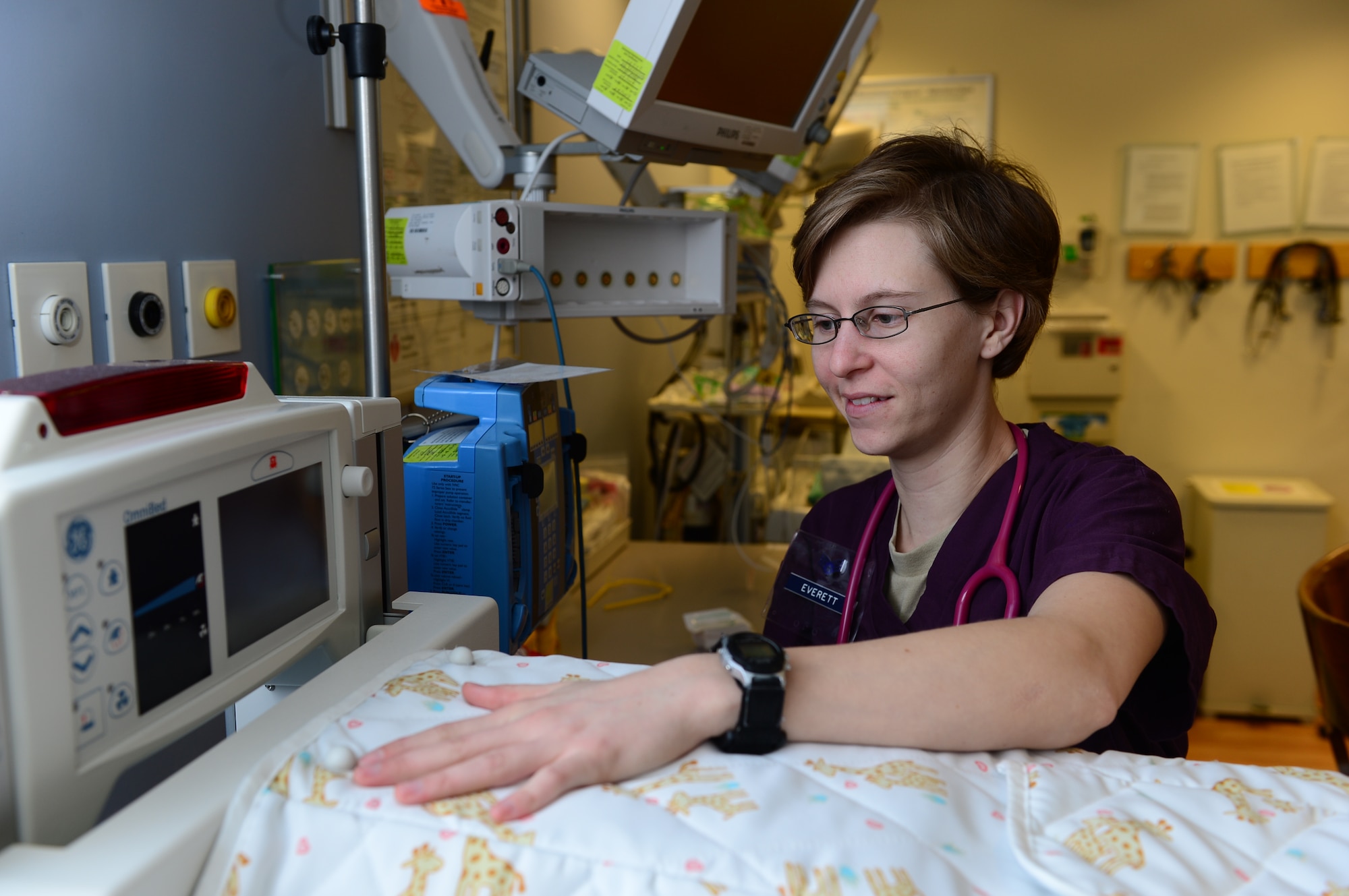 Staff Sgt. Lauren Everett, 48th Inpatient Squadron maternal child care technician, prepares a delivery room at Royal Air Force Lakenheath, England, Jan. 31, 2013. Everett was recently announced as one of the service's top enlisted members and named one of the 12 Outstanding Airmen of the Year for 2013. (U.S. Air Force photo by Senior Airman Lausanne Genuino/Released)